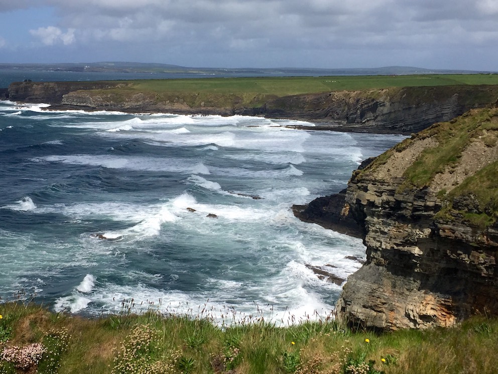 Big Atlantic waves rolling into the Bromore Cliffs in County Kerry