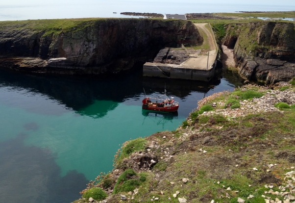 Harbour on Tory with crystal clear water.