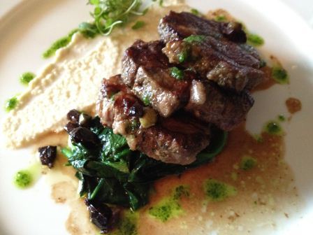 Marinated lamb neck fillet, ajo blanco, buttered greens, black olives & capers